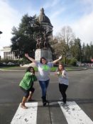 Three teens posing at the Capitol Building in Olympia, WA