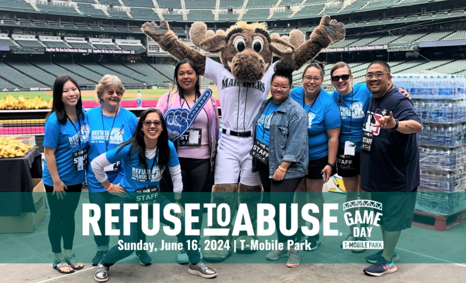 WSCADV staff and board stand with the Mariners Moose at T-Mobile Park at the 2022 Refuse To Abuse 5K.