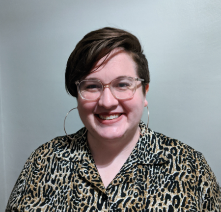 Picture of Heather, a person with short dark brown hair, smiling at the camera.